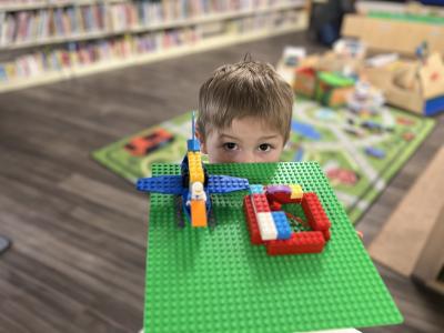 Child showing LEGO creation